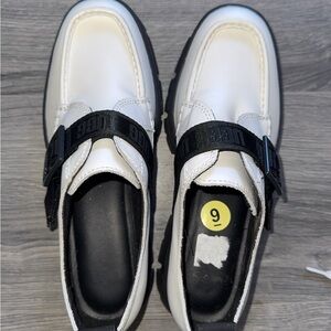 Chic White Loafers with Black Strap